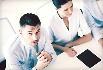 Image showing serious businessman on meeting in office