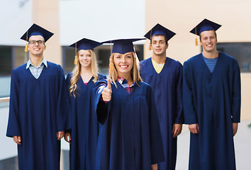 Image showing group of smiling students in mortarboards