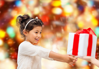 Image showing smiling little girl with gift box