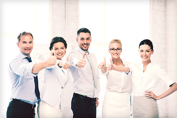 Image showing business team showing thumbs up in office