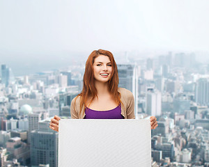 Image showing smiling teenage girl with white board