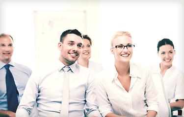 Image showing businessmen and businesswomen on conference