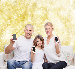 Image showing happy family with smartphones