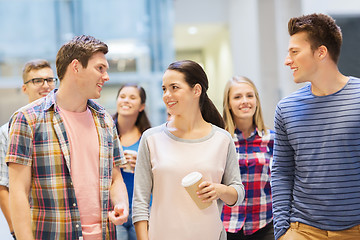 Image showing group of smiling students with paper coffee cups