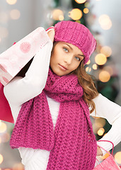 Image showing smiling young woman with shopping bags