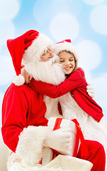 Image showing smiling little girl with santa claus