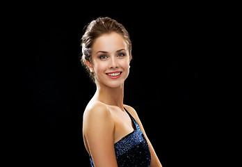 Image showing smiling woman in evening dress