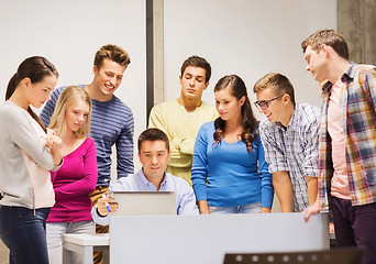 Image showing group of students and teacher with laptop