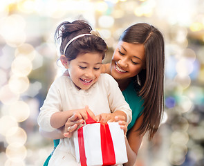 Image showing happy mother and little girl with gift box