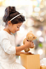 Image showing smiling little girl with gift box