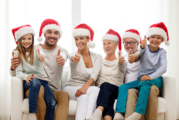 Image showing happy family sitting on couch at home