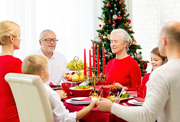 Image showing smiling family having holiday dinner at home