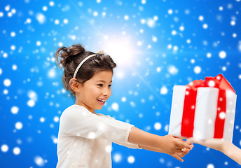 Image showing smiling little girl with gift box