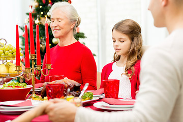 Image showing smiling family having holiday dinner at home