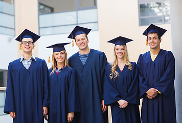 Image showing group of smiling students in mortarboards