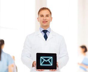 Image showing smiling male doctor with tablet pc