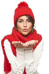 Image showing Winter woman blowing a kiss