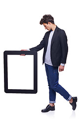 Image showing Full length man holding empty frame