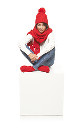 Image showing Winter woman sitting on blank billboard placard sign