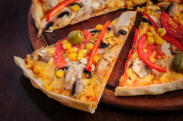 Image showing Pizza with Mozzarella, Mushrooms, Olives and Tomato Sauce