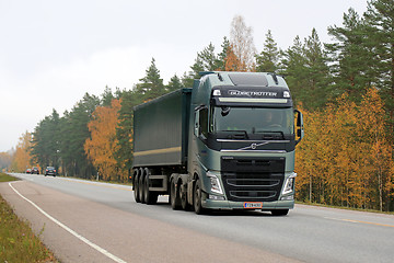 Image showing Green Volvo FH Semi Truck on the Road in Autumn