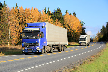 Image showing Three Trucks Platooning on a Highway in Autumn