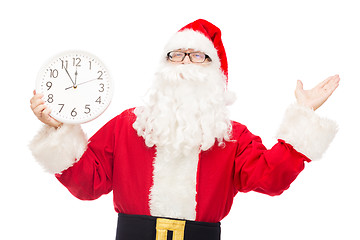 Image showing man in costume of santa claus with clock