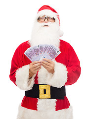 Image showing man in costume of santa claus with euro money