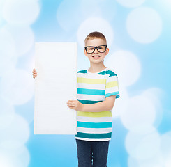 Image showing smiling boy in eyeglasses with white blank board