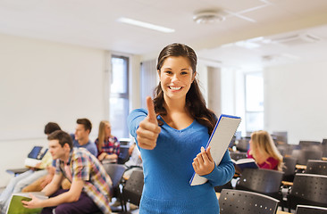 Image showing group of smiling students in lecture hall