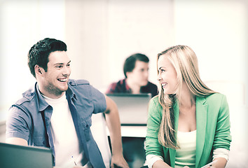 Image showing smiling students looking at each other at school