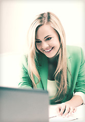 Image showing businesswoman with laptop in office
