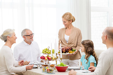 Image showing smiling family having holiday dinner at home