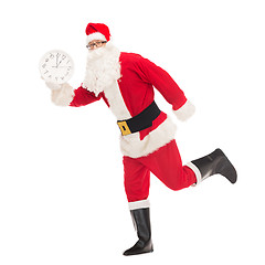 Image showing man in costume of santa claus with clock