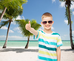 Image showing smiling little boy over green background