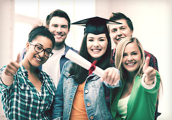 Image showing student girl in graduation cap with diploma