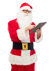 Image showing man in costume of santa claus with tablet pc