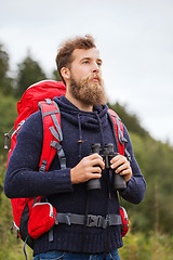 Image showing man with backpack and binocular outdoors