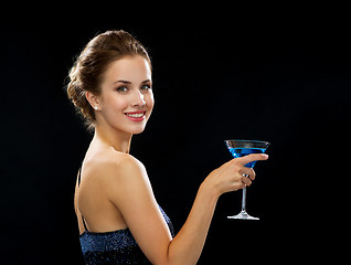 Image showing smiling woman holding cocktail