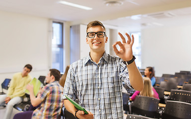 Image showing group of smiling students in lecture hall