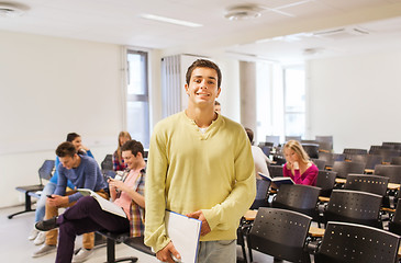 Image showing group of smiling students in lecture hall