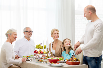 Image showing smiling family having holiday dinner at home