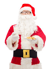 Image showing santa claus with glass of milk and cookies