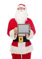 Image showing man in costume of santa claus with tablet pc