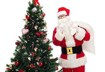 Image showing santa claus with bag and christmas tree