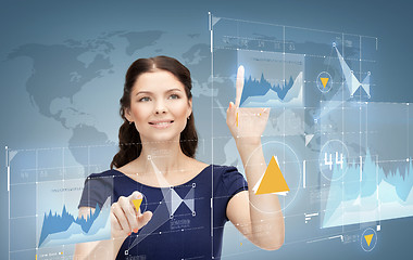 Image showing smiling businesswoman working with virtual screen