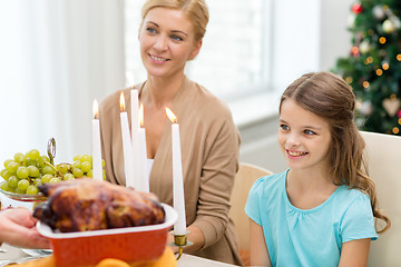 Image showing smiling family having holiday dinner at home