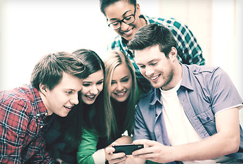 Image showing students looking at smartphone at school