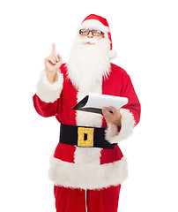 Image showing man in costume of santa claus with notepad