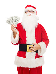 Image showing man in costume of santa claus with dollar money